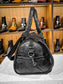 BLACK FLOATER NECESSARY BAG